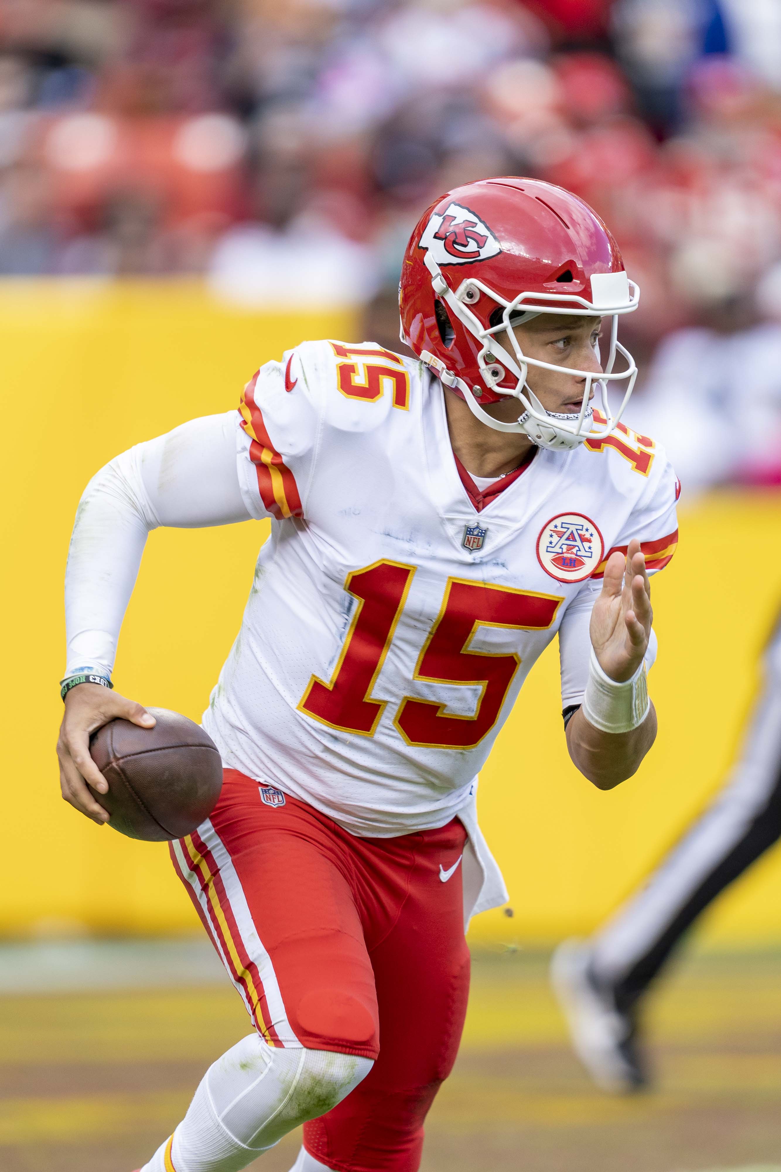 Patrick Mahomes carrying the ball for Kansas City, archival 2021 photograph