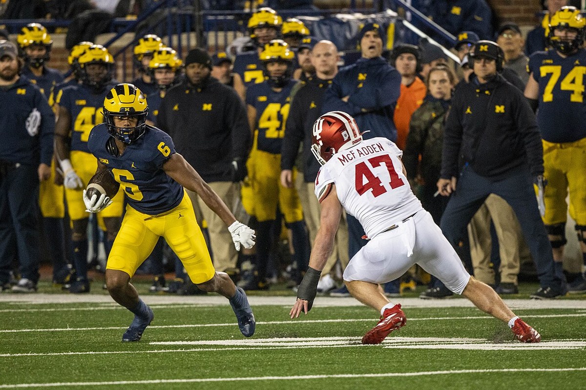 Indiana faces Michigan in November 2021. Archival team-action photograph; no player shown is identified as a current participant.