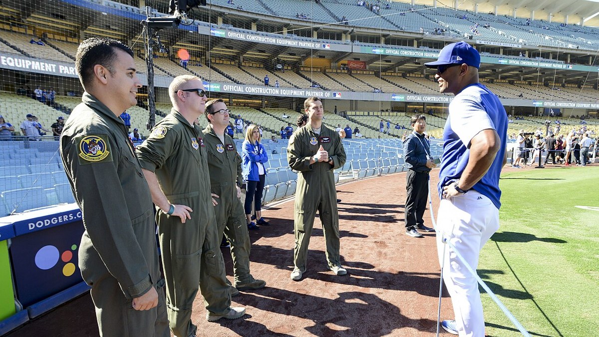 Dodgers manager Dave Roberts meets U.S. service members before 2018 NLCS Game 3. Archival photograph; it is not from today’s game.