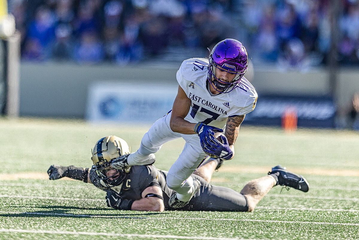 East Carolina receiver Anthony Smith is tackled against Army in October 2024. Historical team-action photograph; players shown are not identified as current participants.