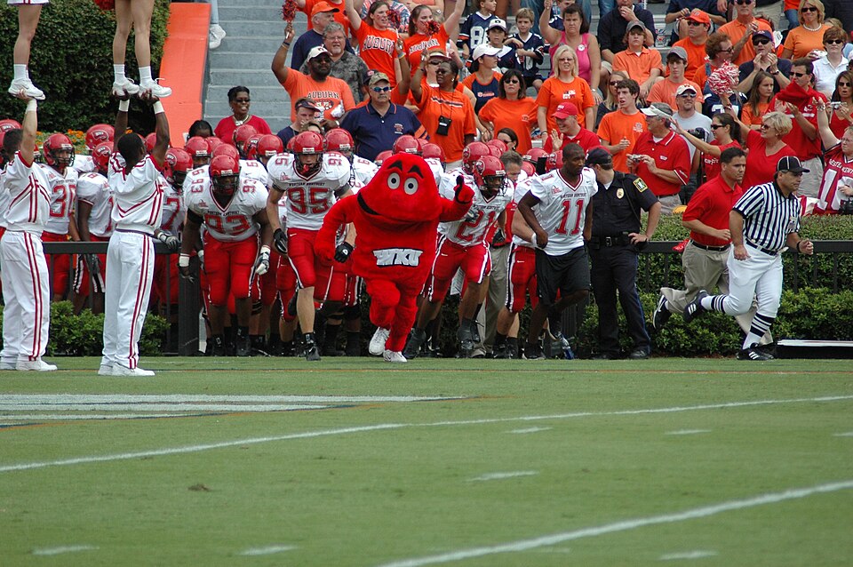 WKU’s football team takes the field at Auburn in September 2005. Historical team photo; pictured players are not presented as current participants.