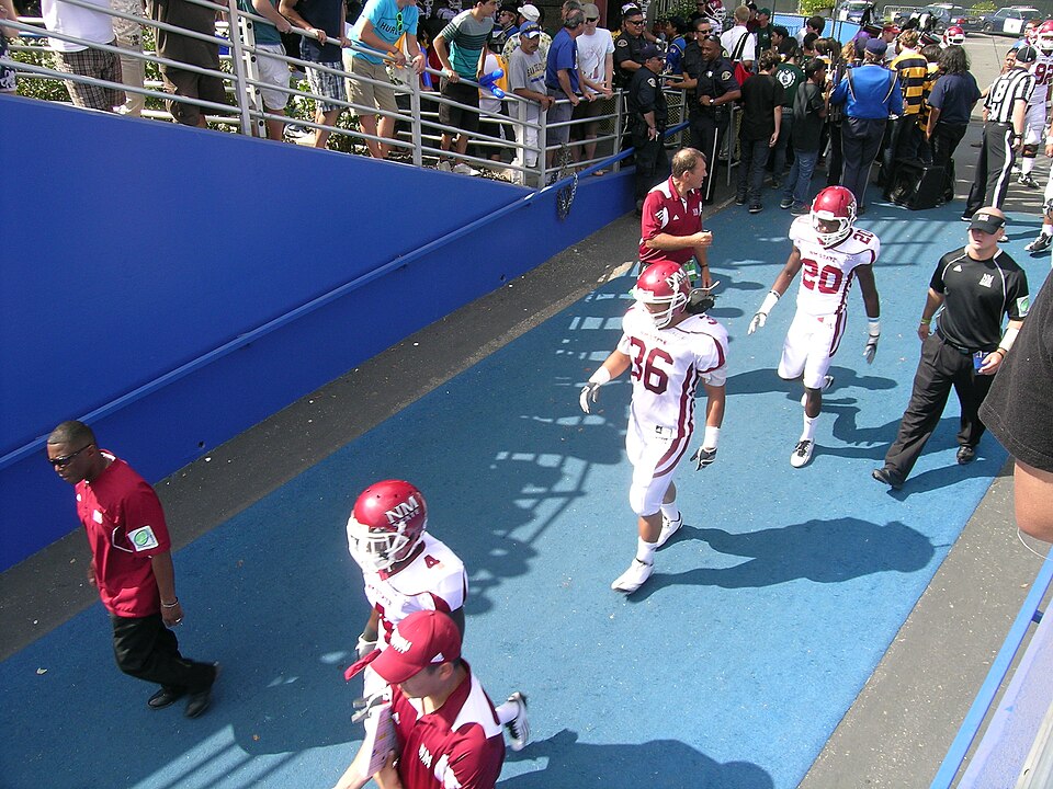 New Mexico State players enter the field at San Jose State in September 2011. Historical team photo; pictured players are not presented as current participants.
