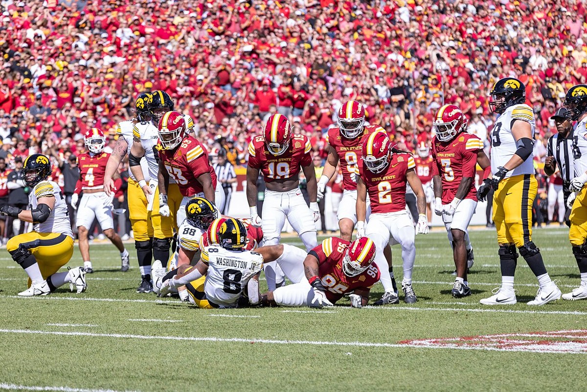 Iowa and Iowa State players during the September 2025 Cy-Hawk game at Jack Trice Stadium. Archival rivalry photograph, not from tonight’s Washington game.